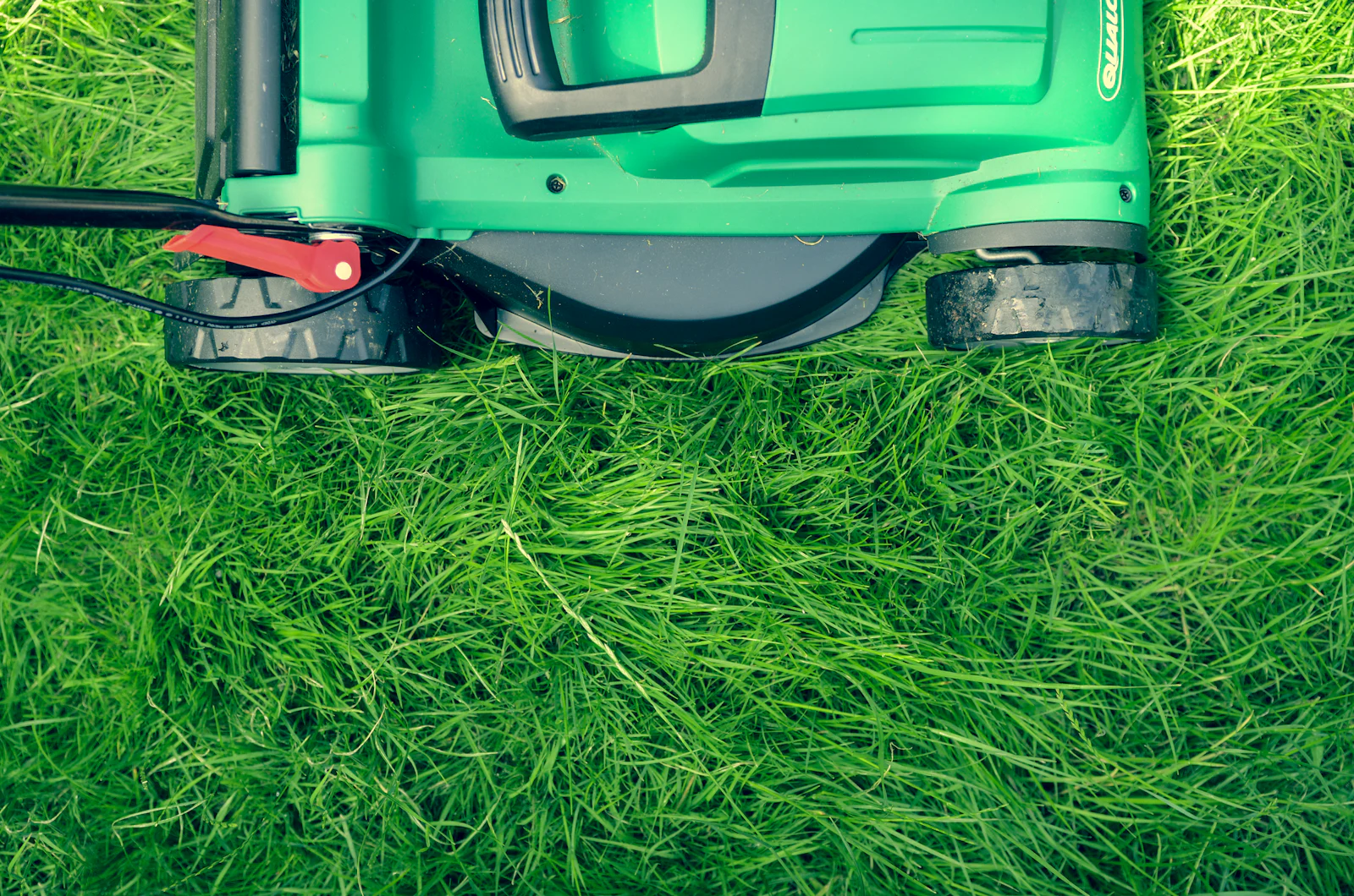 A lawn mower standing on grass